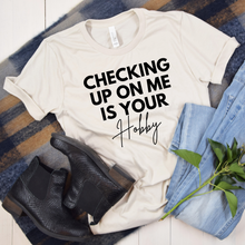 Load image into Gallery viewer, Wholesale Checking up on me is your hobby Graphic Tee - Heather Sunset Tee
