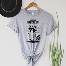 Load image into Gallery viewer, Wholesale I caused them all raccoon Graphic Tee - Heather Sunset Tee
