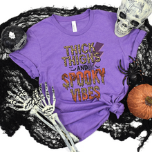 Load image into Gallery viewer, Wholesale Thick Thighs Spooky Vibes Graphic Tee - Heather Team Purple Tee
