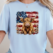 Load image into Gallery viewer, Wholesale Patriotic Highland Cow Graphic Tee - Baby Blue Tee
