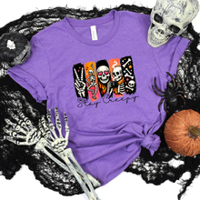 Load image into Gallery viewer, Wholesale Halloween Stay Creepy Skull Graphic Tee - Heather Team Purple
