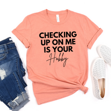 Load image into Gallery viewer, Wholesale Checking up on me is your hobby Graphic Tee - Heather Dust Tee
